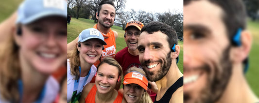 Group photo of Tony Banovich in baseball cap and friends during Run Wild Missoula